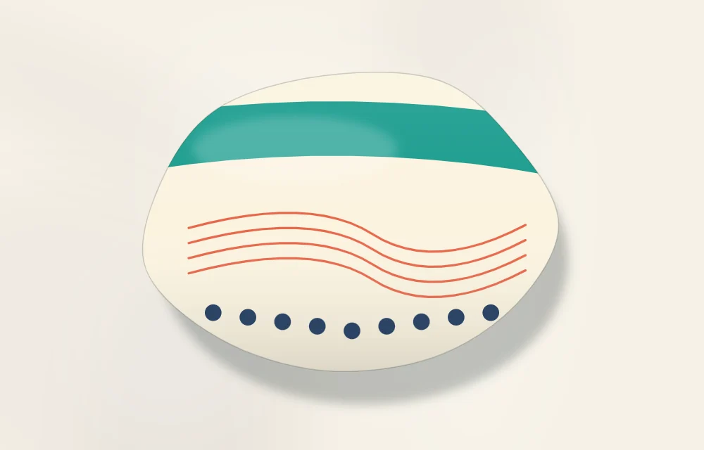 Single stone showing three kinds of marks: a broad band of color, thin curved lines and a row of small dots