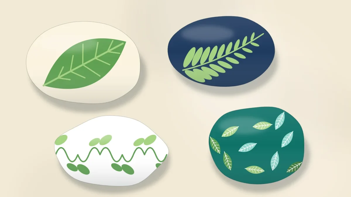 Four stones painted with leaves in several greens: a large leaf with veins, a fern frond, a vine with small leaves and a scattered leaf pattern
