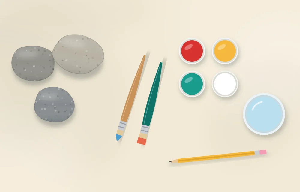 Beginner kit in a row: three bare smooth stones, two paintbrushes, four small pots of acrylic paint, a jar of water and a pencil