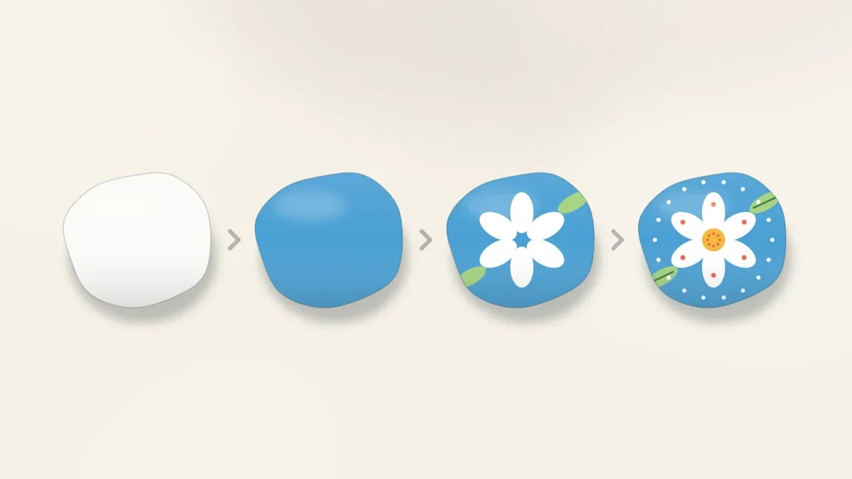 Four stones in a row showing one design built in layers: white base coat, blue background, large shapes, then small highlights and dots
