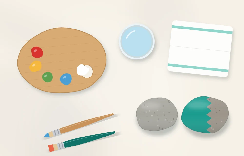 Workspace layout: wooden palette with paint, jar of water, folded cloth, brushes and two stones, one of them partly painted